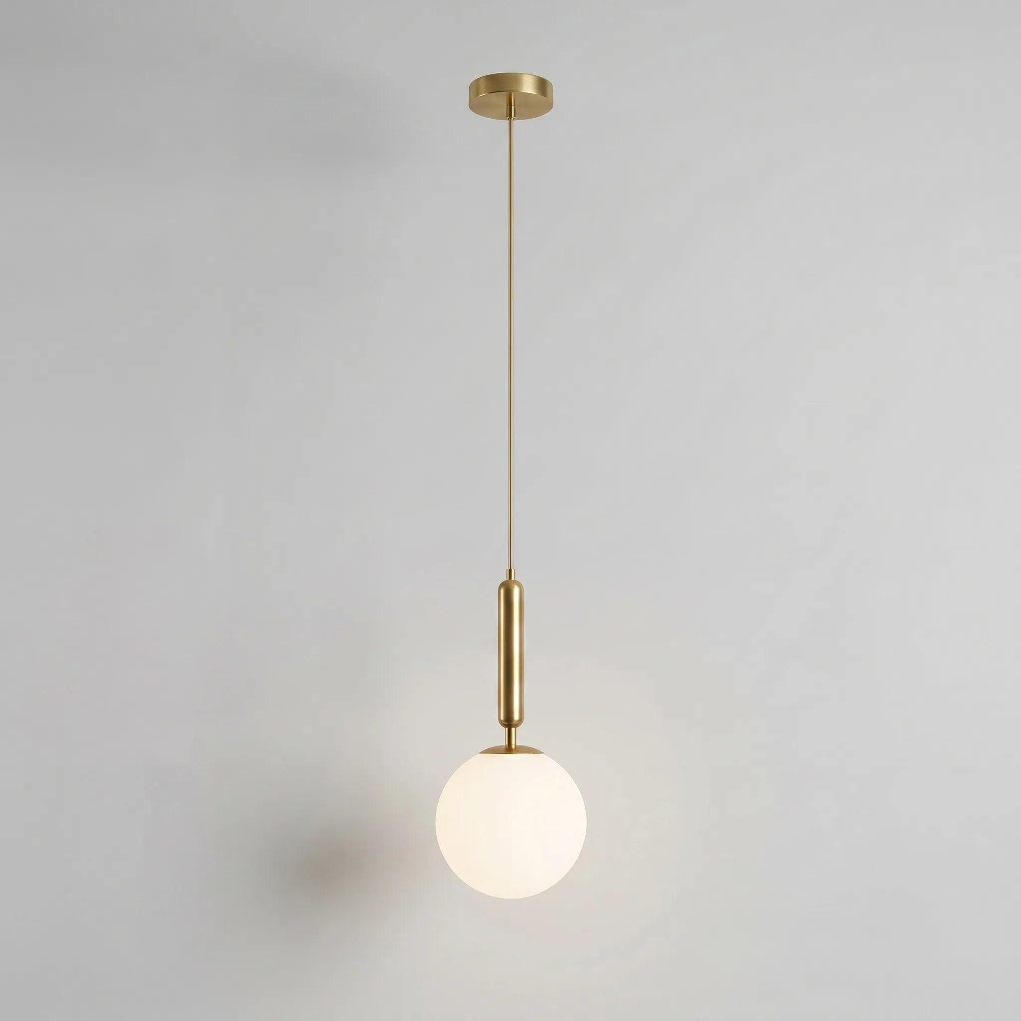 Minimalist Globe Pendant Light -  Illuminating Dining Spaces - Wildoxy