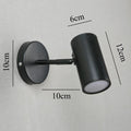 Foco de pared LED integrado giratorio, metal negro y dorado