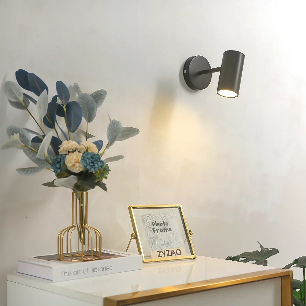Foco de pared LED integrado giratorio, metal negro y dorado