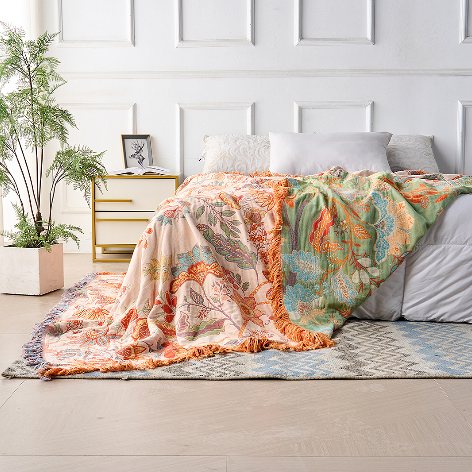 Baumwolldecke – Orange-blaue Boho-Blumen auf Creme, mit Fransen