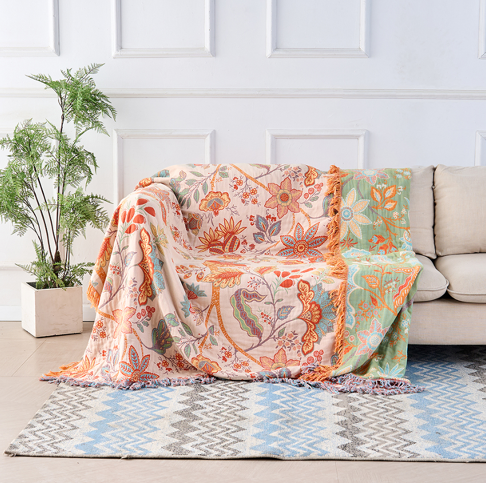Baumwolldecke – Orange-blaue Boho-Blumen auf Creme, mit Fransen