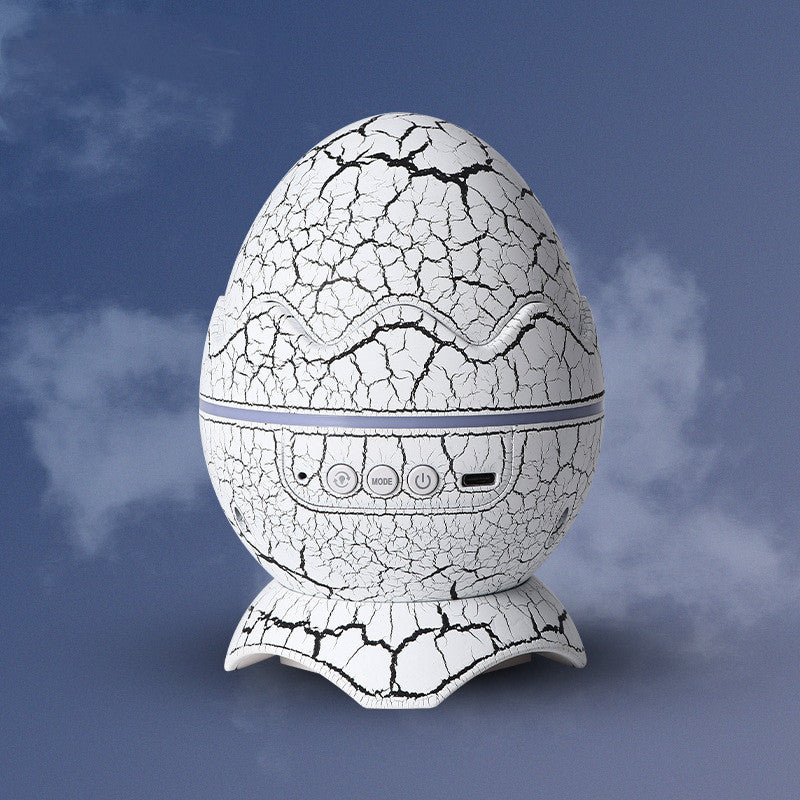 Luz nocturna con forma de huevo de dinosaurio — Proyector y altavoz Bluetooth