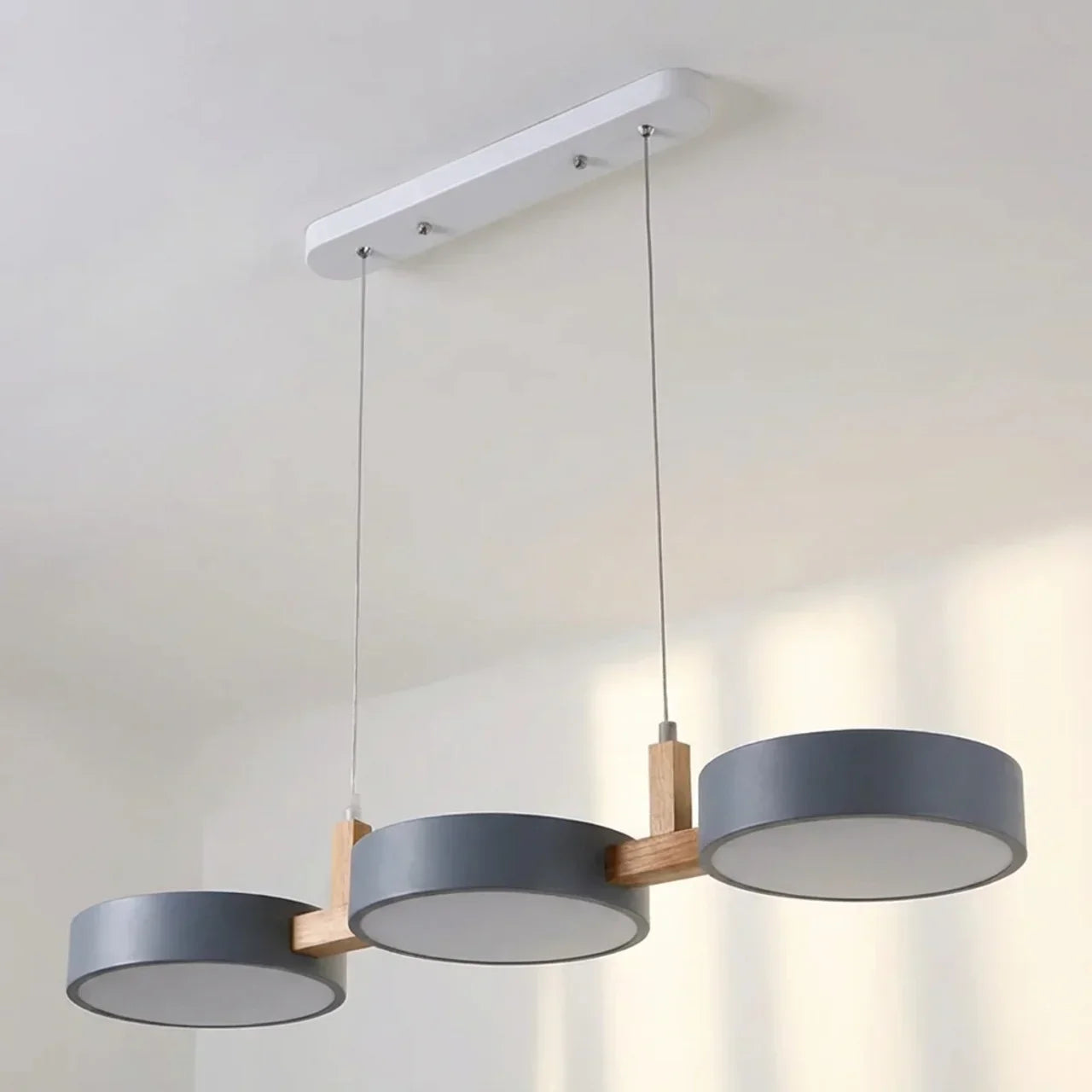 Linear Solid Wood Beam Pendant — Staggered Metal Drum Shade Cluster