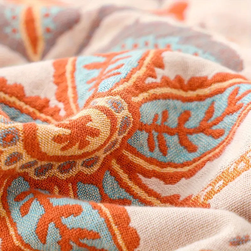 Baumwolldecke – Orange-blaue Boho-Blumen auf Creme, mit Fransen